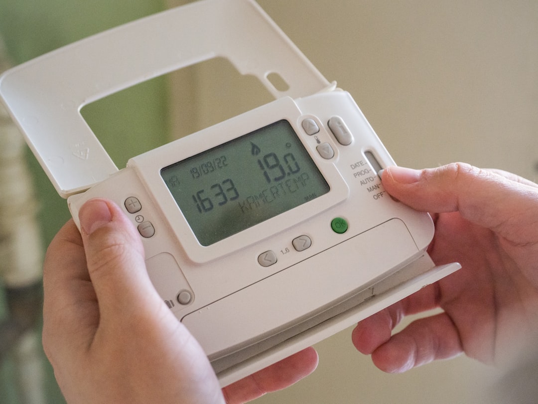 a-person-holding-a-device-yg19gb9jw0i